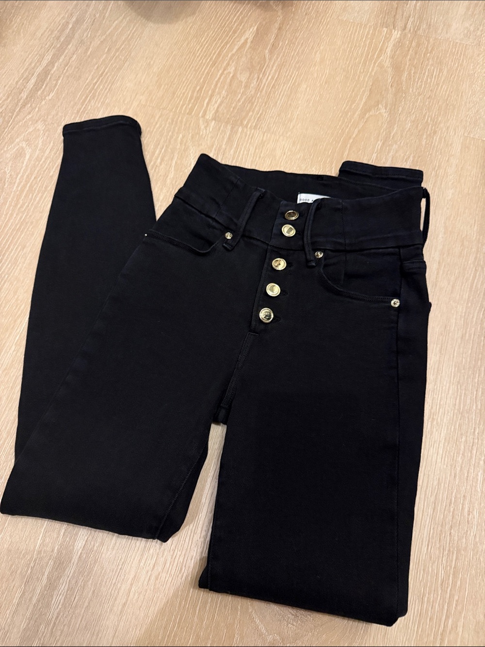 Good American Black Skinny Jeans with Gold Buttons